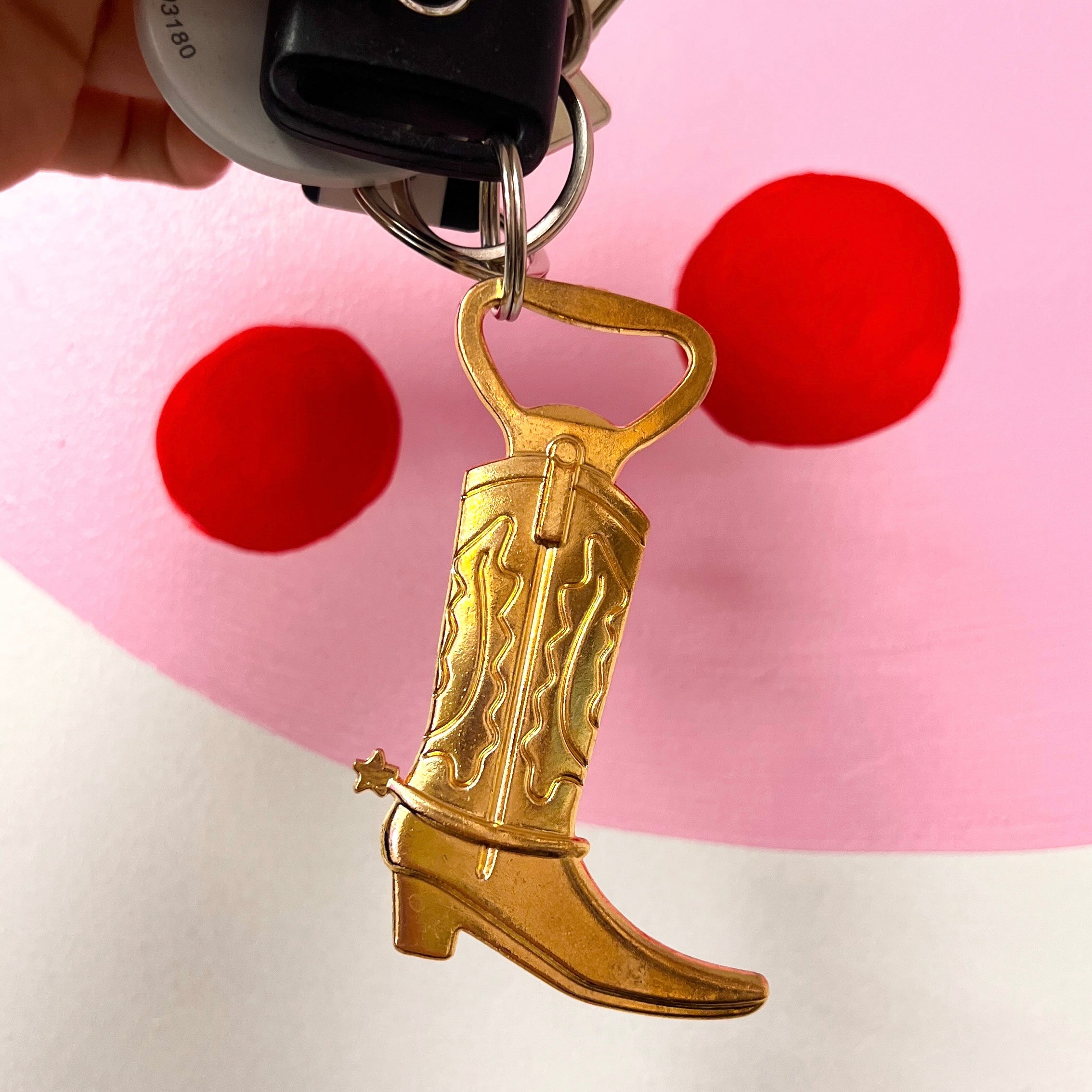 Metal cowboy boot bottle opener/keychain