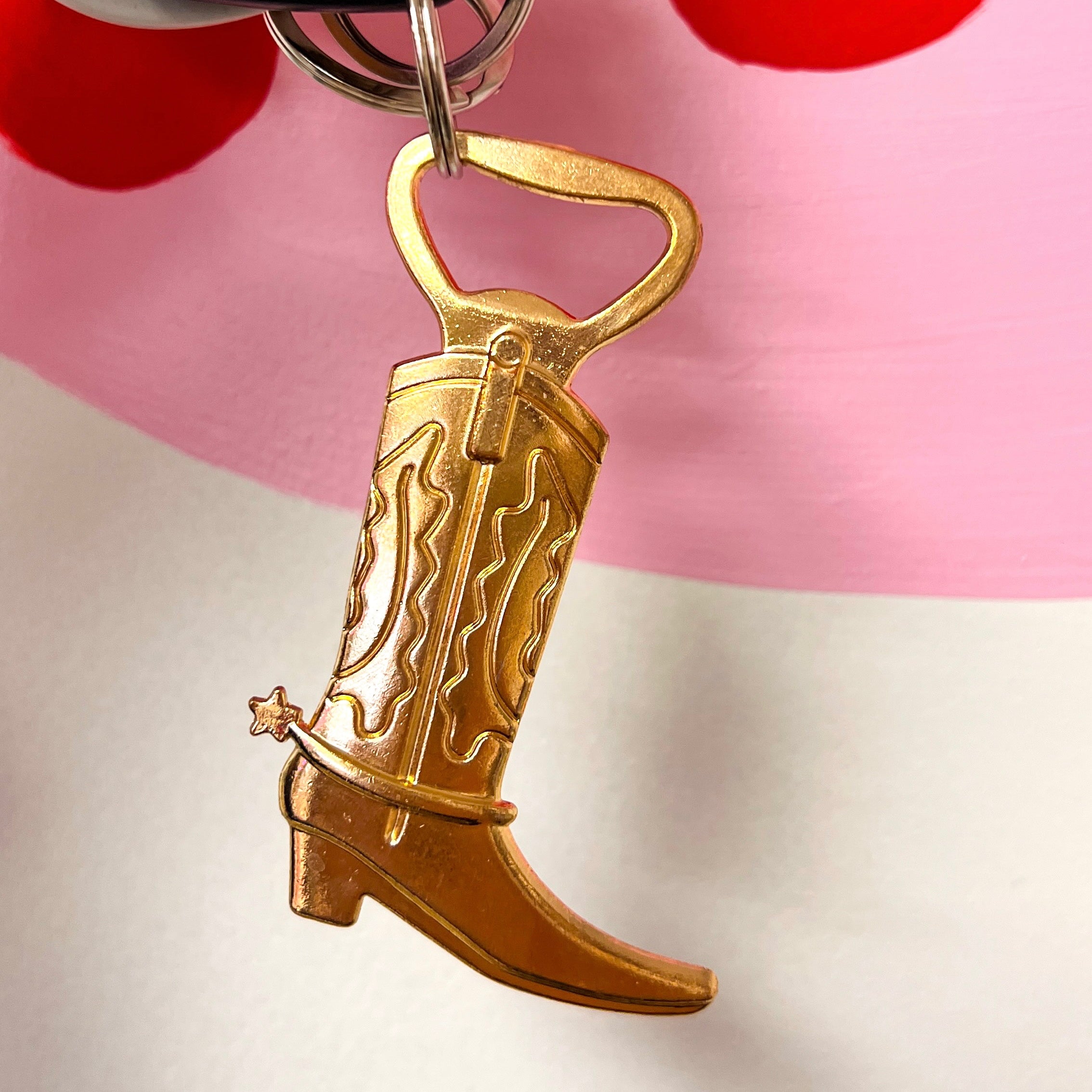 Metal cowboy boot bottle opener/keychain